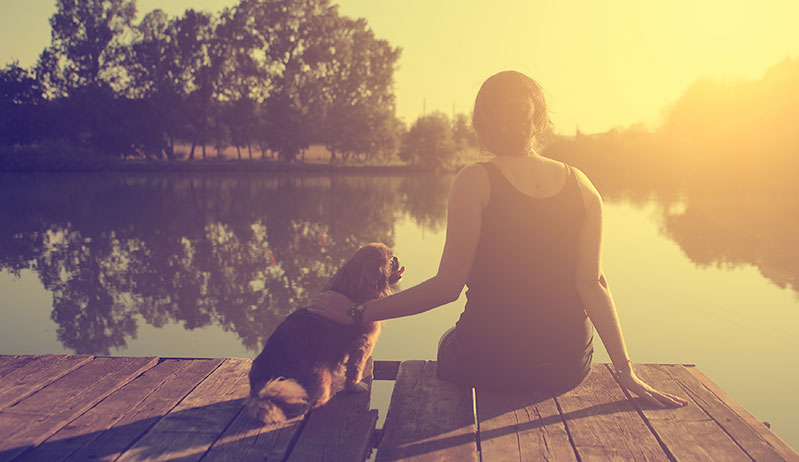 woman and her dog bonding